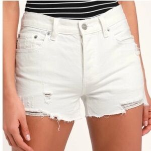 Distressed white jean shorts